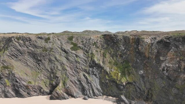 Majestic basalt rocks and high cliffs of western Portugal. Praia do Medo, Arrifana