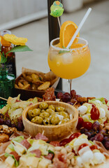 Aperitif with cocktail on the table.