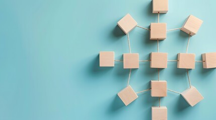 Teamwork concept with wooden blocks connected together with white tube on a blue carpet background.