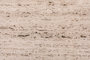 Textured Beige Travertine Stone Background With Natural Patterns and Rough Surfaces