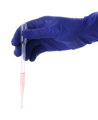 Scientist holding transfer pipette with liquid on white background, closeup