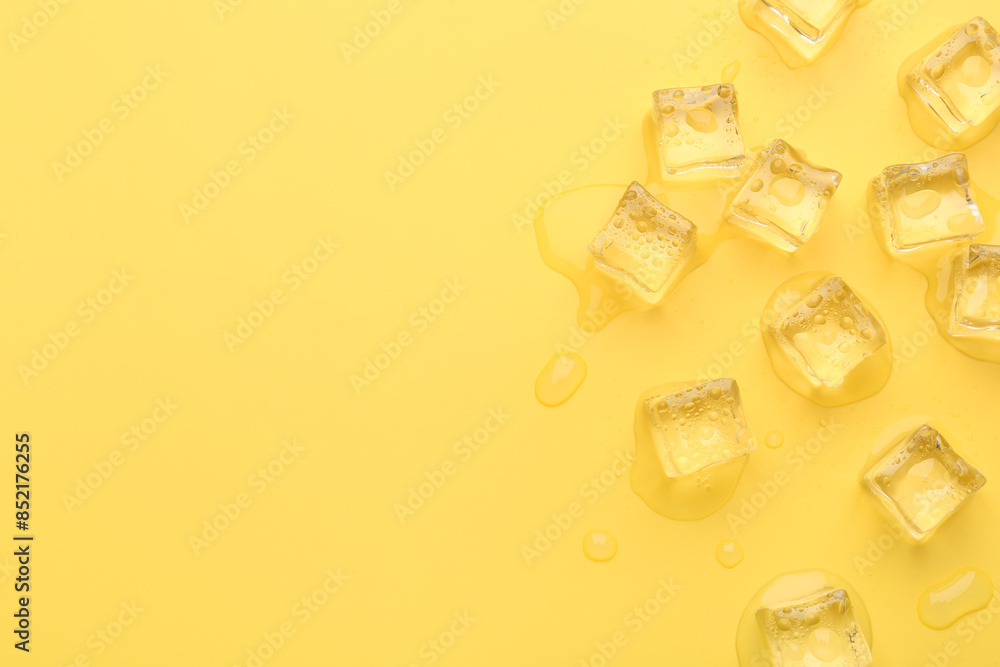 Poster Crystal clear ice cubes on yellow background, flat lay. Space for text