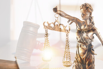 Law. Double exposure of Lady Justice figure and gavel