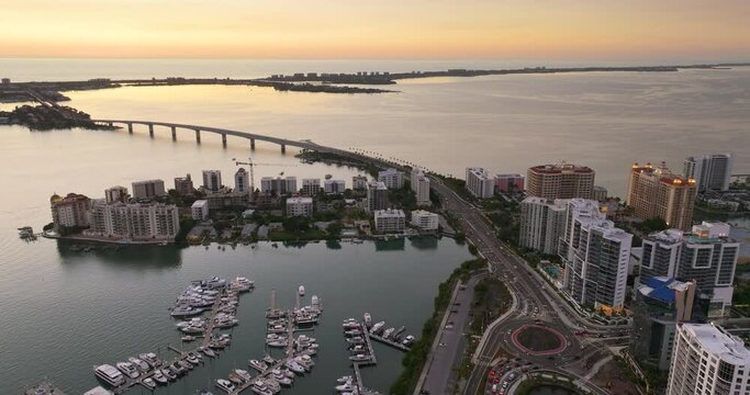 Sarasota, Florida city downtown at sunset with expensive bayfront high-rise buildings. Urban travel destination in the USA.