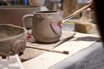 shape clay with hands