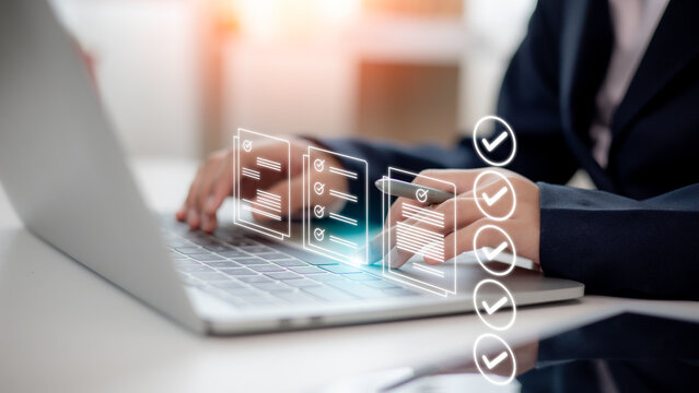 Women touching a virtual screen to tick mark documents for online approval. Prepare, check, and approve concepts. Document management is paperless, ensuring quality assurance and ERP management.