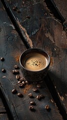 A cup of coffee and scattered beans on the table against a wooden background