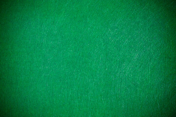 Fototapeta premium Green felt texture with vignette