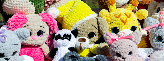 Panorama of soft bright toys as a background