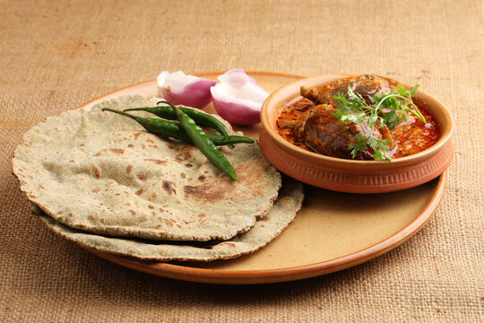 Multigrain Roti or millet flat bread.Made with chana ,caun, green moong , udad ,ragi , Jowar farmer's lunch Indian bread with Brinjal curry
