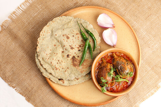Multigrain Roti or millet flat bread.Made with chana ,caun, green moong , udad ,ragi , Jowar farmer's lunch Indian bread with Brinjal curry