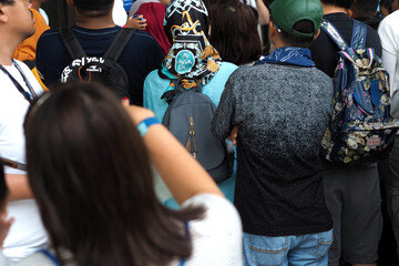 Fototapeta premium visible from behind the people queuing