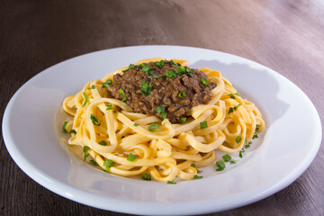 pasta dish with bolognese and sauce.