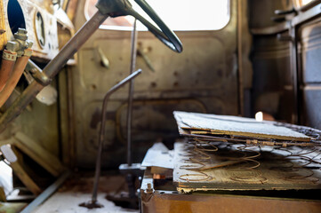 Rusted out springs and interior of an old truck 