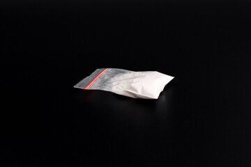 Cocaine in plastic packet isolated on black background. illustration of illegal drug substances,...