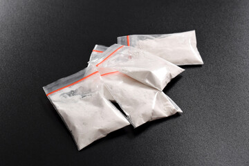 Cocaine in plastic packet isolated on black background. illustration of illegal drug substances, narcotics