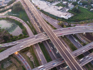 City transport traffic intersection road with car vehicle movement at dusk aerial view