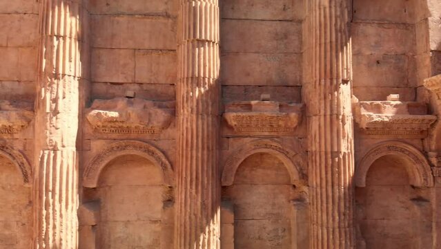 A shot of the ancient archaeological wonder Roman ruins at Baalbek, a UNESCO World Heritage site in Lebanon's Bekaa Valley. Towering columns, intricate stonework.