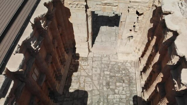 A shot of the ancient archaeological wonder Roman ruins at Baalbek, a UNESCO World Heritage site in Lebanon's Bekaa Valley. Towering columns, intricate stonework.