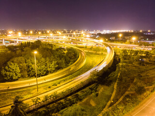 Aerial view circular intersection transport city road at night with light vehicle movement