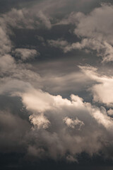 Clouds catching the sunlight with a dramatic dark storm in the background