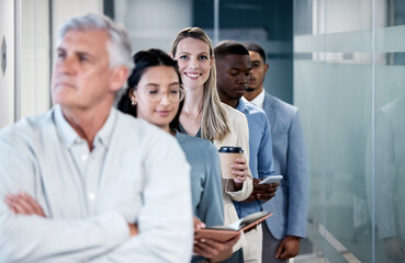 Fototapeta premium Woman, portrait and smile in queue for interview, recruitment and opportunity for job in hallway. Person, group and line for offer, onboarding and hiring with coffee, happy or career in modern office