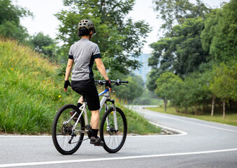 Fototapeta premium Mountain biking on summer forest trail