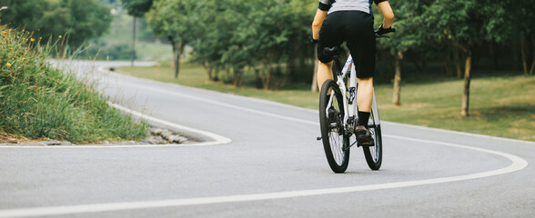 Mountain biking on summer forest trail