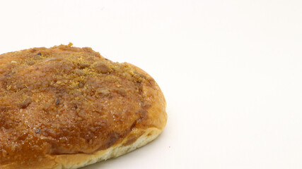 Delicious bread with shredded topping isolated