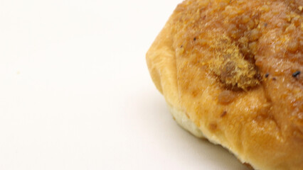 Delicious bread with shredded topping isolated