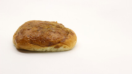 Delicious bread with shredded topping isolated
