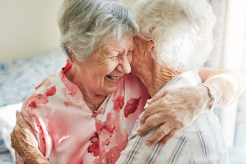 Happy, friends and senior women hug in nursing home with care, trust or excited for reunion, joy or bonding. Hello, smile or old people embrace in retirement house with gratitude, support and comfort