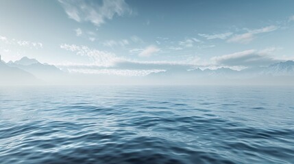 Obraz premium Tranquil ocean with soft ripples, framed by a misty mountainous horizon