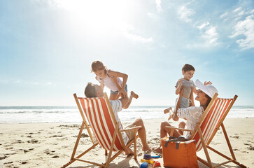 Family, beach and kids relax chair vacation adventure, bonding and play game together on tropical...