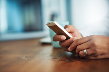 Office, hands and person with smartphone on desk, chatting and text message with contact by mockup. Closeup, businessman and mobile app for networking, reading information and social media on table