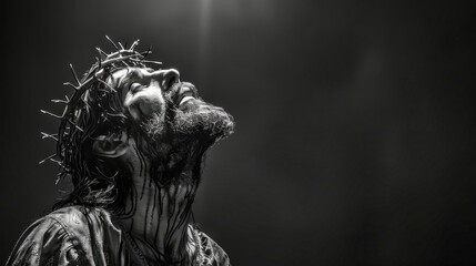 A black and white photograph depicting a man with a crown of thorns, looking upwards, suggesting a depiction of Jesus Christ during his crucifixion