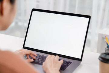 Woman hand using laptop and type on the keyboard, Mockup screen of advertisement.