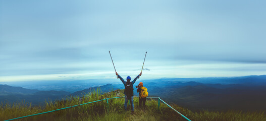 Lover woman and man Asian travel nature. Travel relax. Walk study the path Nature in the forest