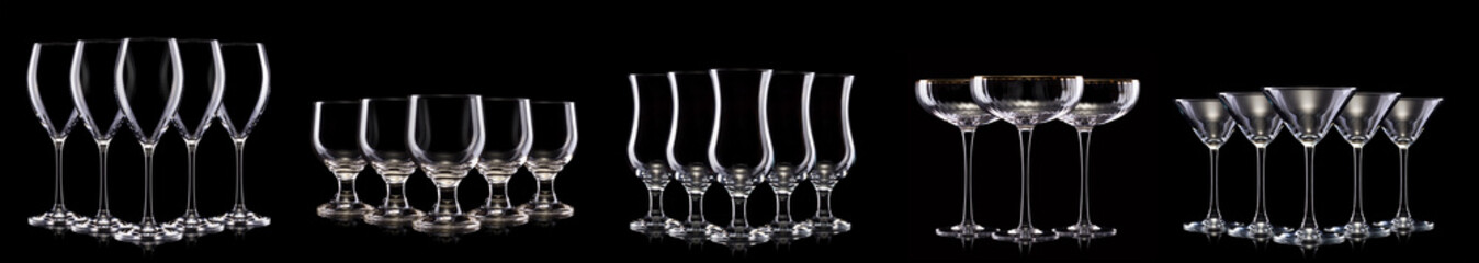 Set of different empty glasses for drinks and cocktails on black background