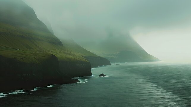 The serene landscapes of the Faroe Islands, with dramatic cliffs and rolling green hills