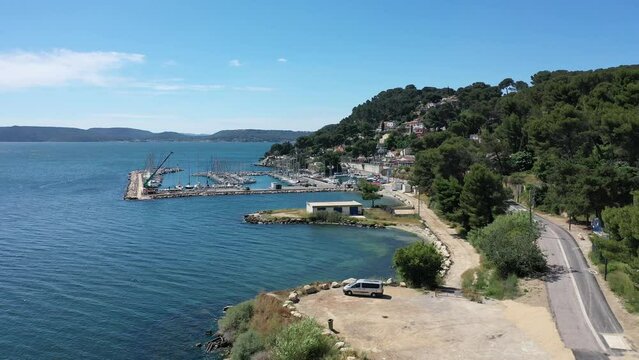 Aerial view drone video flying from the air over the picturesque sea coast of the south of France, Provence, Istres at bright sunny summer day