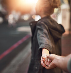 Love, pov and couple holding hands in city for trip, bonding and connection on outdoor date. Follow, man and woman together in town on vacation, holiday and travel on journey for tourism in France