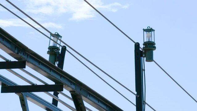 Lighthouse emergency lights mounted with cables on scaffolding