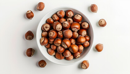 white bowl with raw hazelnut kernels on a white background. Bowl with tasty organic hazelnuts on white background