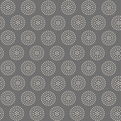 Seamless vector pattern of simple white circles in the shape of a mandala on a gray background, design for textile print, wrapping paper, decorative wallpaper.
