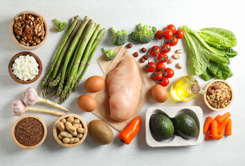 Many different healthy food on white wooden table, flat lay