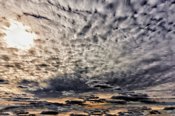 During the day, the sun tries to show through the dark clouds