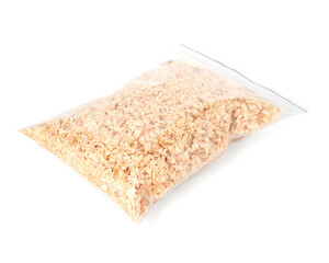 Natural sawdust in zip bag isolated on white