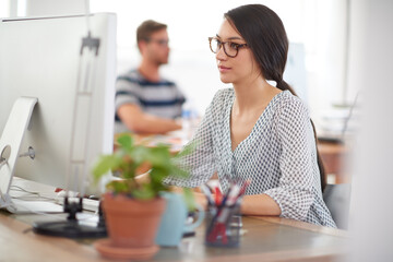 Creative, startup or woman on computer for information technology, problem solving or online...