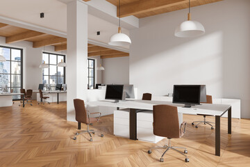 Office coworking interior with pc computers on tables in row, panoramic window